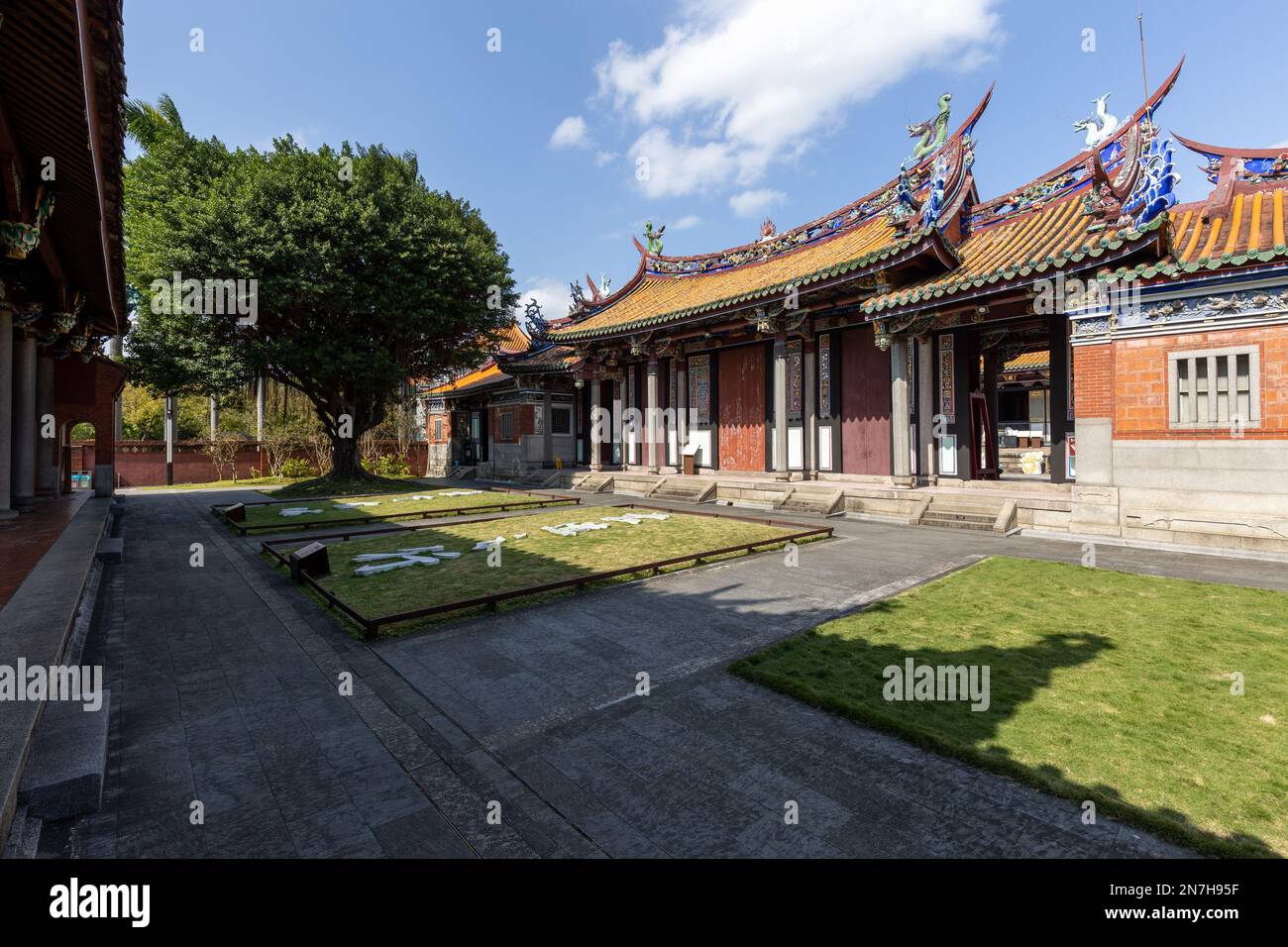 A temple yard with a large banyan tree at the Confucius Temple in Taipei, Taiwan. Stock Photo