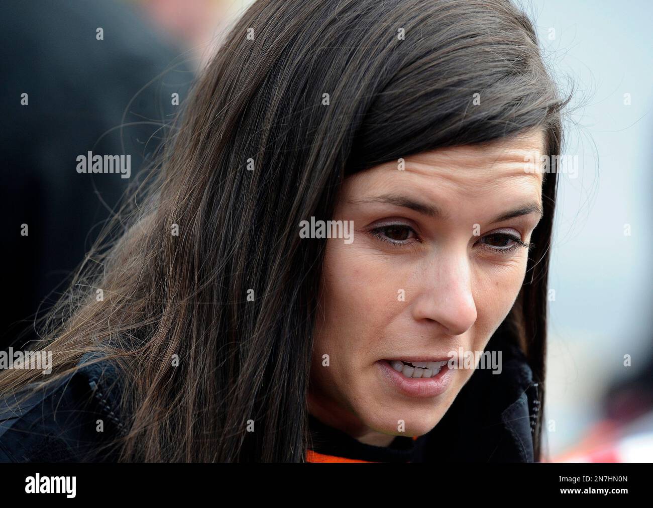 Driver Danica Patrick talks with members of her crew prior to the