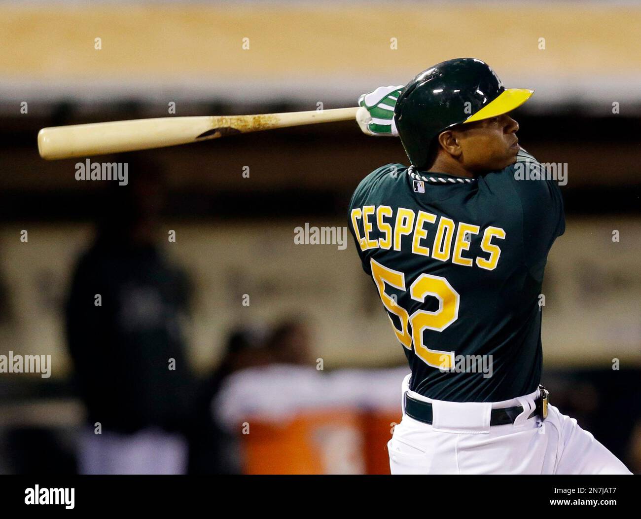 Oakland Athletics' Yoenis Cespedes, right, celebrates his solo home run  with teammate Josh Reddick (16) during the fourth inning of the second game  of a doubleheader baseball game against the Seattle Mariners