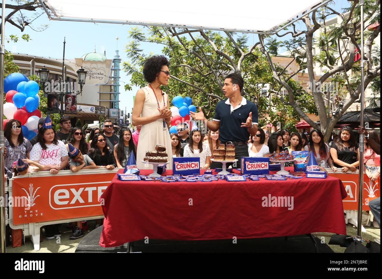Carla Hall, left, and Mario Lopez reveal the final three bakeries at