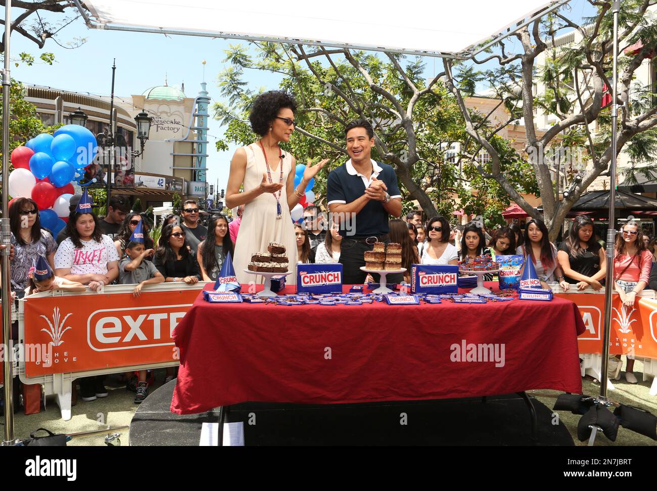 Carla Hall, left, and Mario Lopez reveal the final three bakeries at