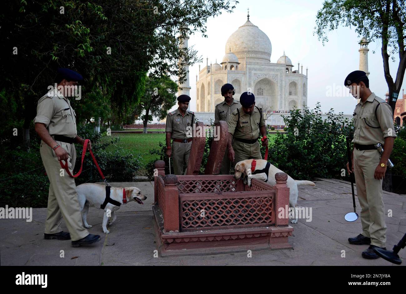 Security personnel conduct a routine patrol aroundthe Taj Mahal ...