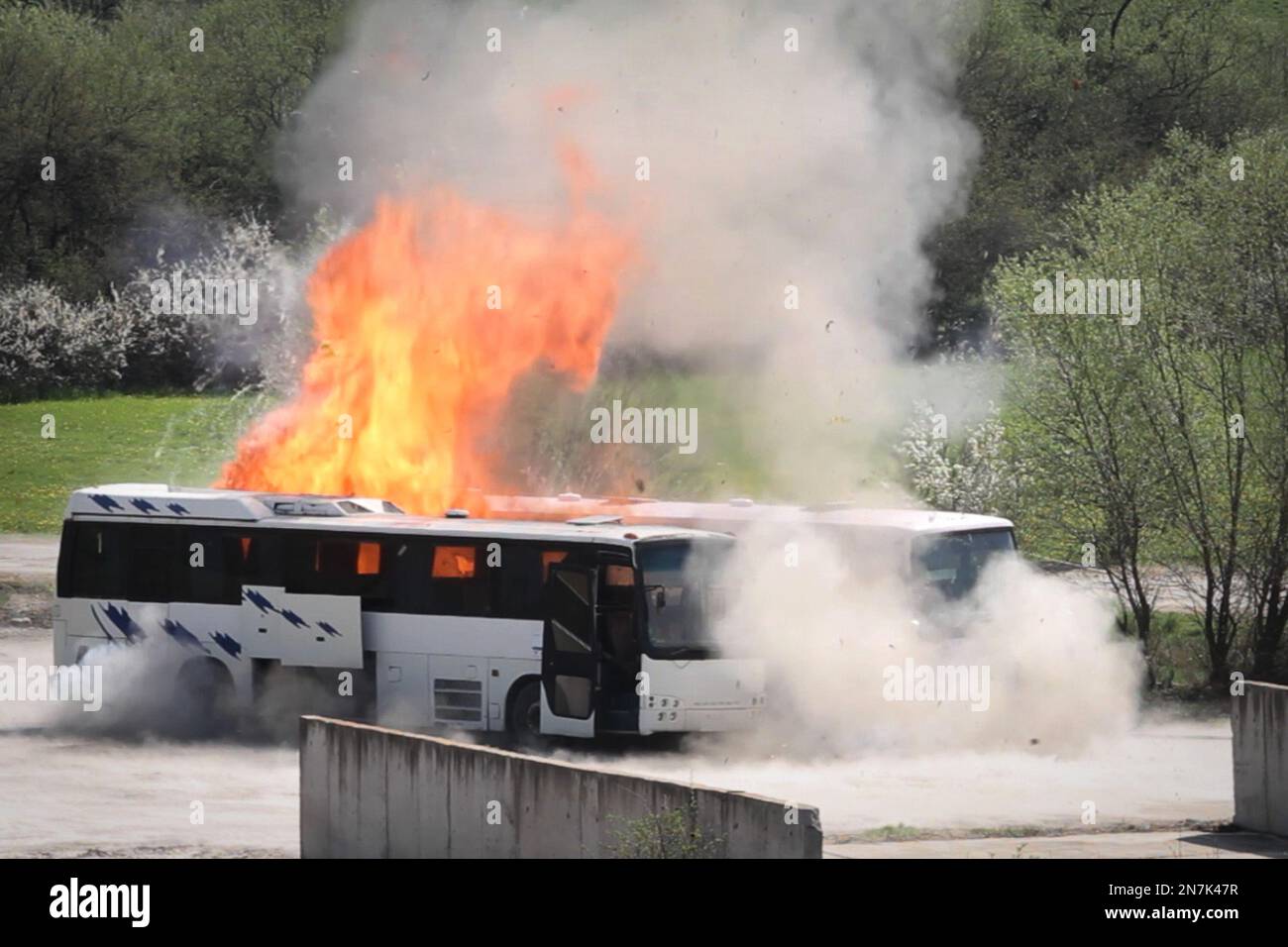 A bus explodes near Ihtiman, on Friday, April 26, 2013, as Bulgarian investigators stage a re-enactment of the bus bombing that killed five Israeli tourists, the bus driver and the alleged perpetrator at the Burgas airport in July. The experiment aimed to provide more details about the attack and was staged at a police compound. (AP Photo/Valentina Petrova) Stock Photo