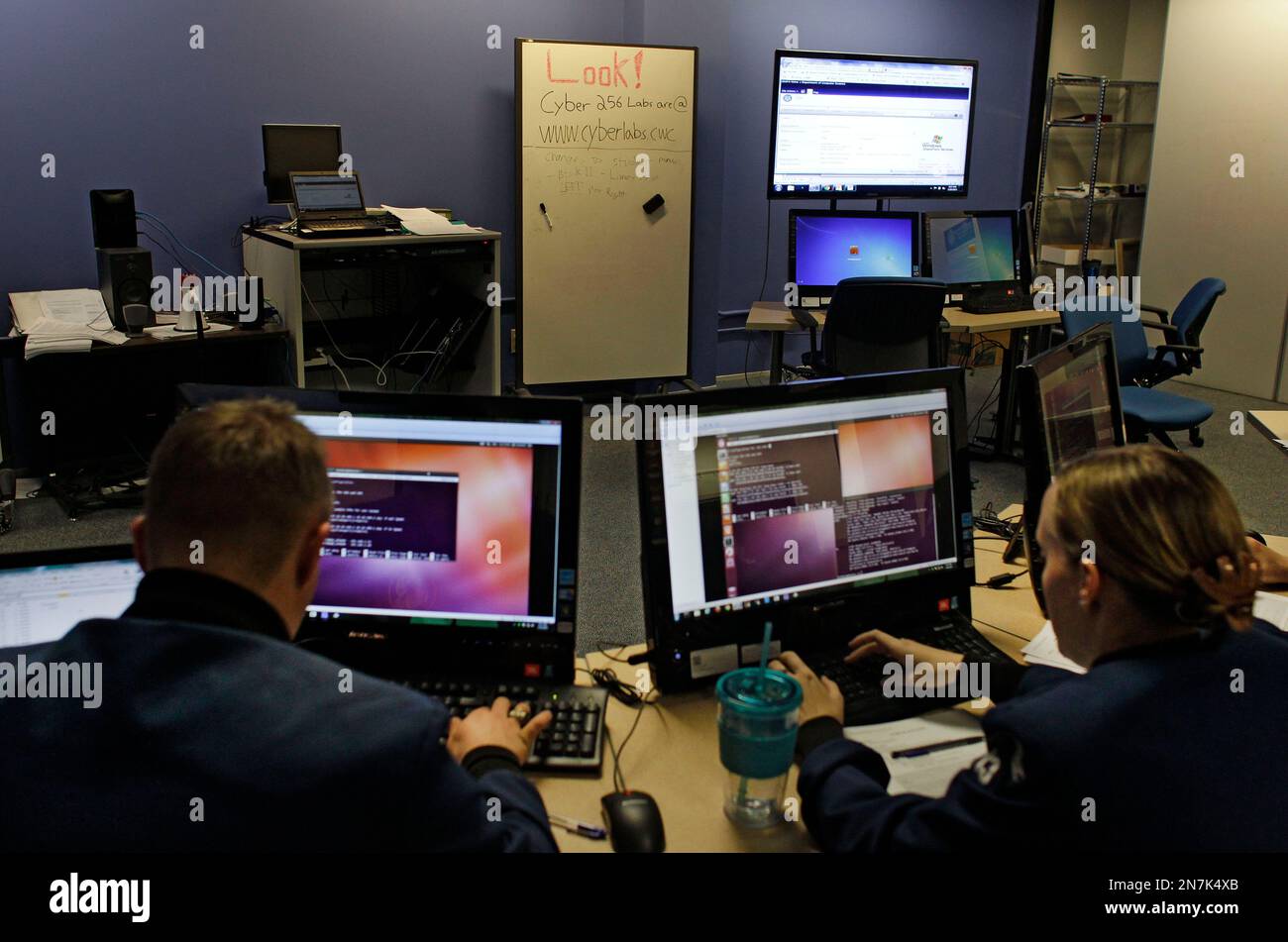 In this Feb. 20, 2013 photo, cadets work at computers inside a ...