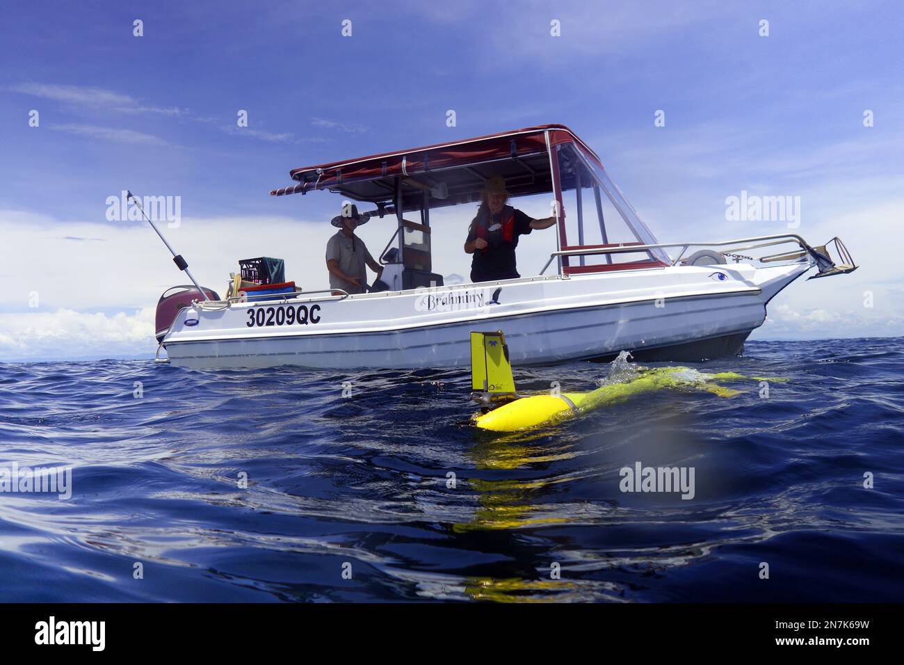 Slocum ocean glider (yellow) that has just been deployed from small charter vessel, Mission Beach, Great Barrier Reef, Queensland, Australia. No MR or Stock Photo