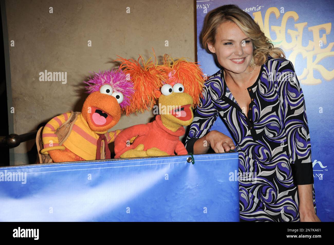 Red Fraggle, left, Gobo Fraggle, and Laura Allen arrive at Jim Henson's