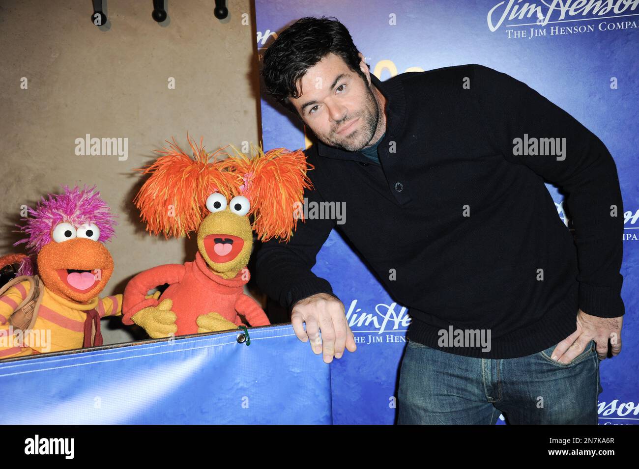 Red Fraggle, left, Gobo Fraggle, and Robert Baker arrive at Jim Henson