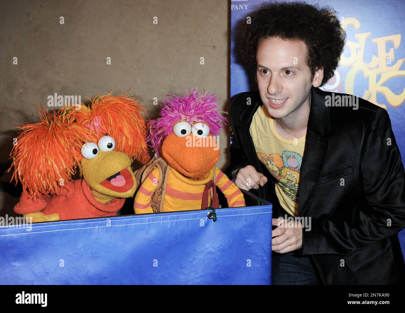 Red Fraggle, left, Gobo Fraggle, and Josh Sussman arrive at Jim Henson