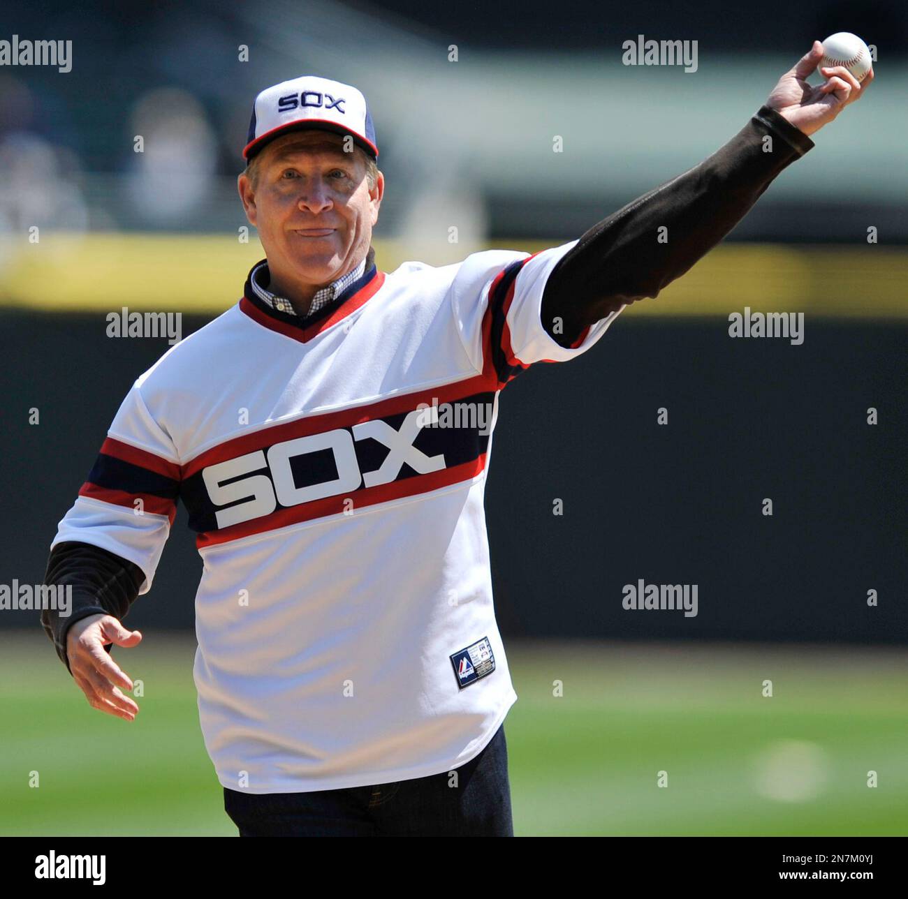 Former Chicago White Sox player Mike Squires, from the 1983 team throws out  the ceremonial first pitch before an MLB baseball game between the Chicago  White Sox and the Minnesota Twins in