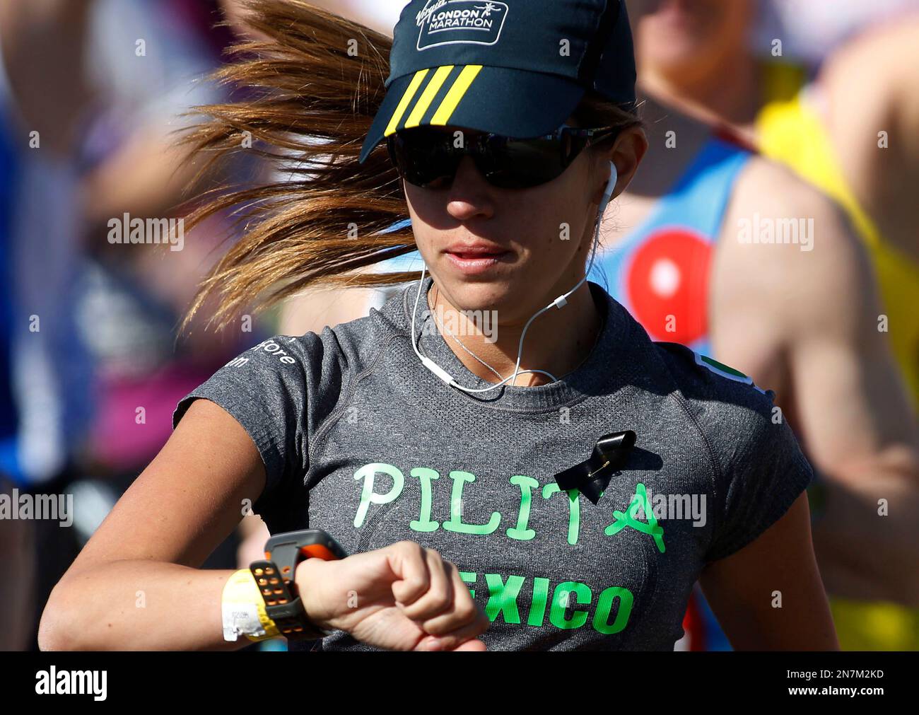 A runner wears a black ribbon in memory of the victims of Boston ...