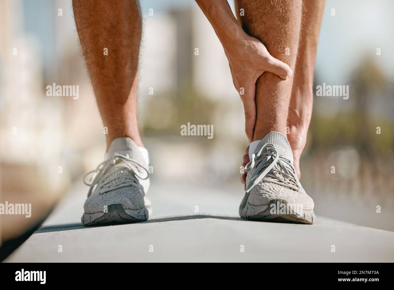 Ankle pain of runner or man hands for fitness healthcare risk, muscle