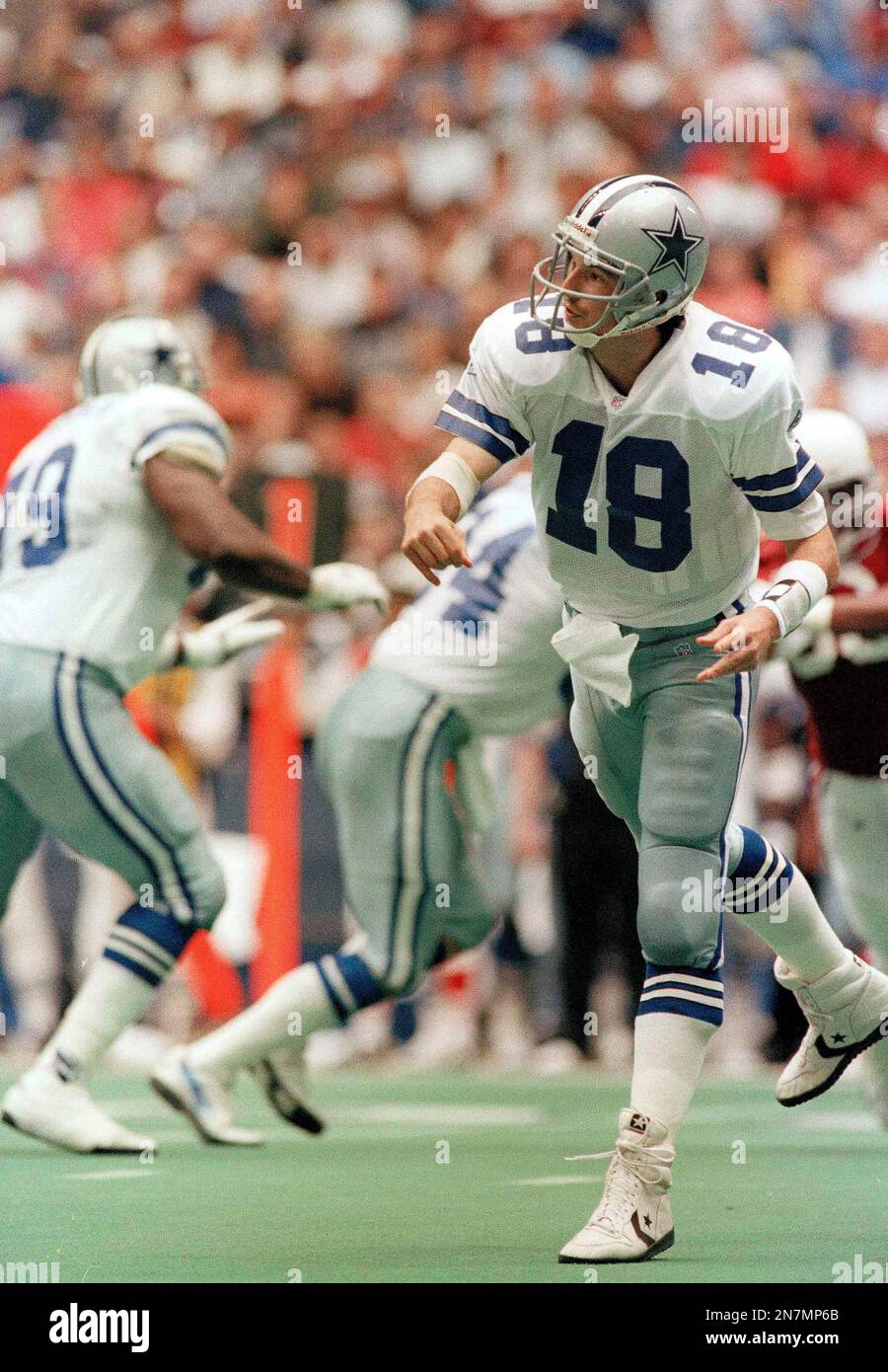 Dallas Cowboys quarterback Bernie Kosar scrambles under the pressure of  Phoenix Cardinals defensive lineman Reuben Davis (93) in the third quarter,  Nov. 14, 1993 in Irving, Texas. (AP Photo/Eric Gay Stock Photo - Alamy