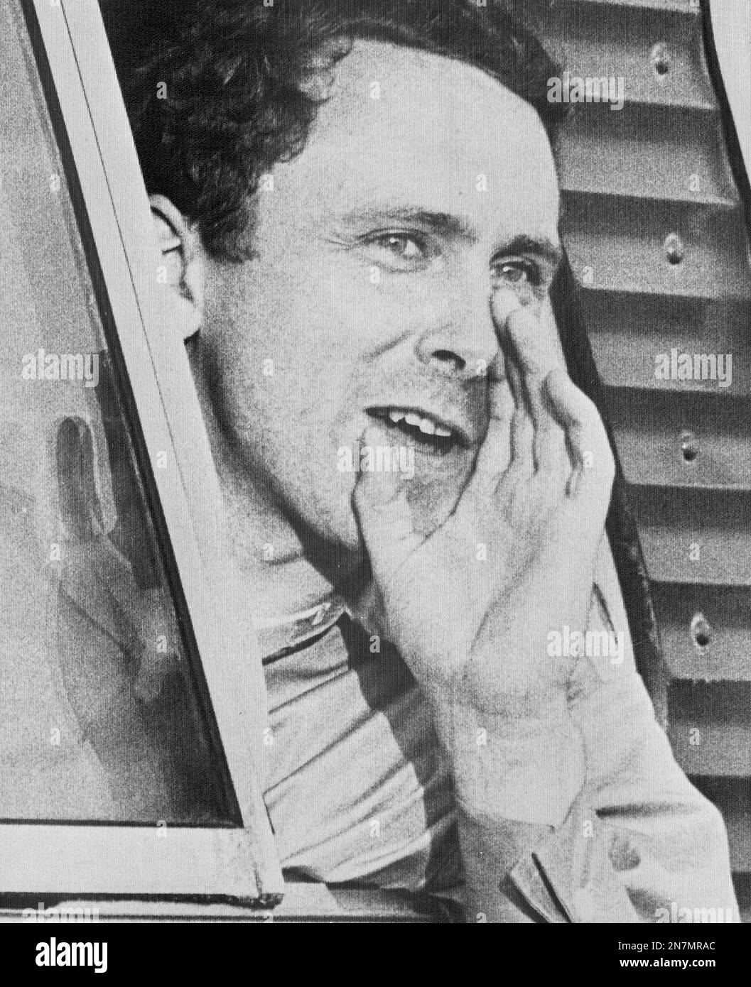 Capt. Wallace G. of Painted Post, NY, shouts out of a bus