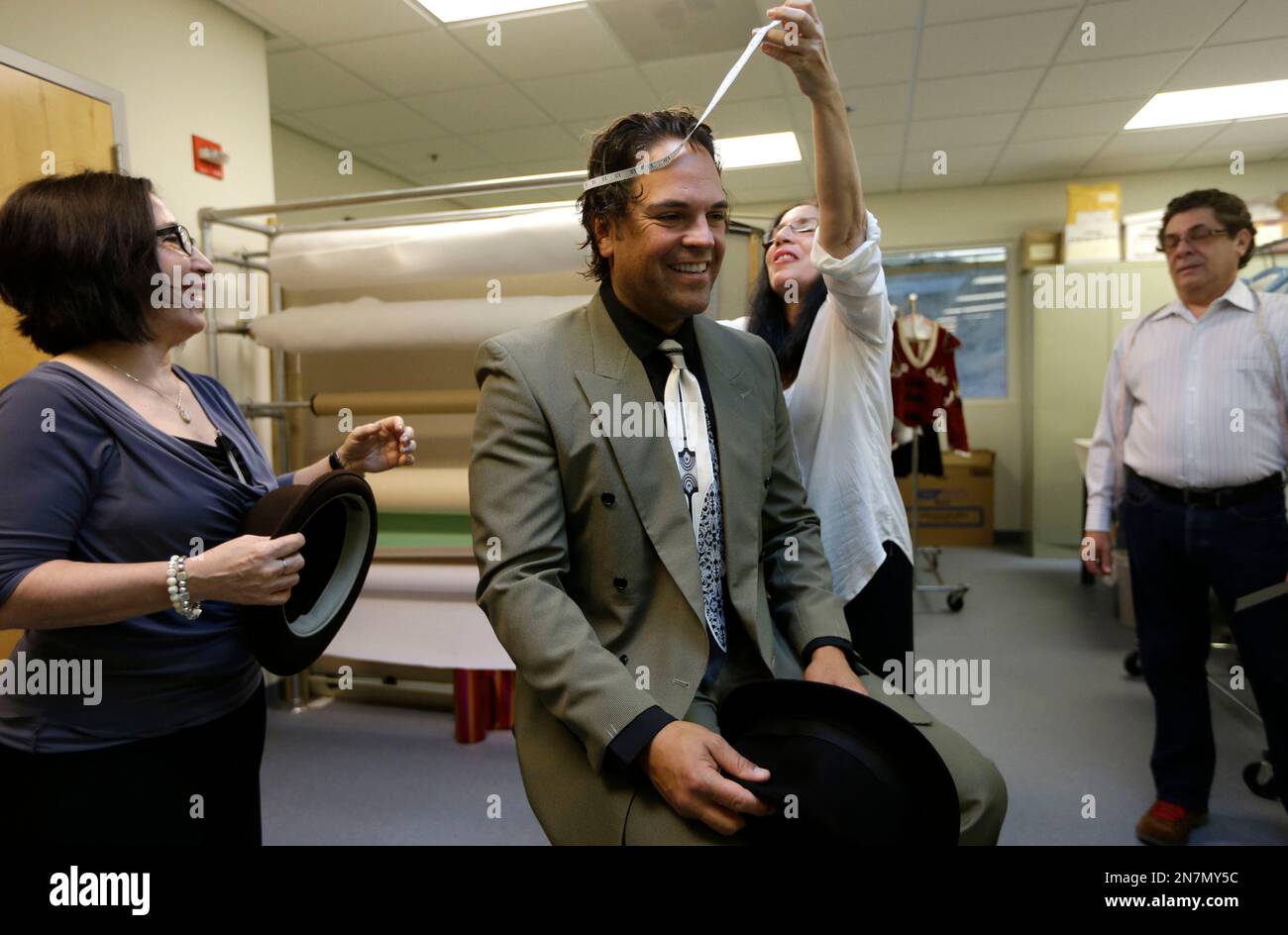 Former MLB baseball player Mike Piazza is fitted for his costume by