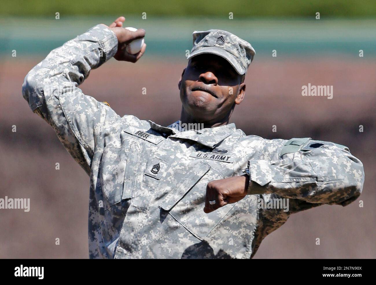 United States Army Sgt. Darryl Rouse throws out the ceremonial first ...