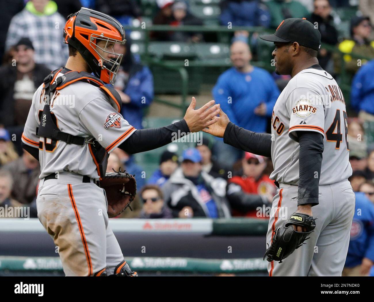 San Francisco Giants closer Santiago Casilla, right, is congratulated by  catcher Hector Sanchez after the Giants' 1-0 victory over the San Diego  Padres in 12 innings in a baseball game Thursday, April