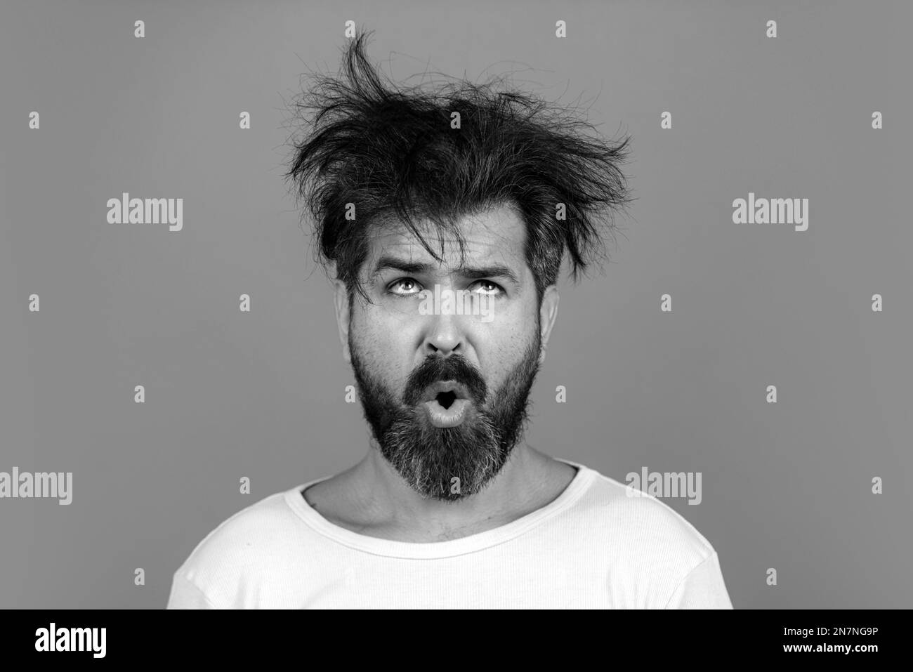 Funny and crazy. Bearded man with messy hair. concept. Long