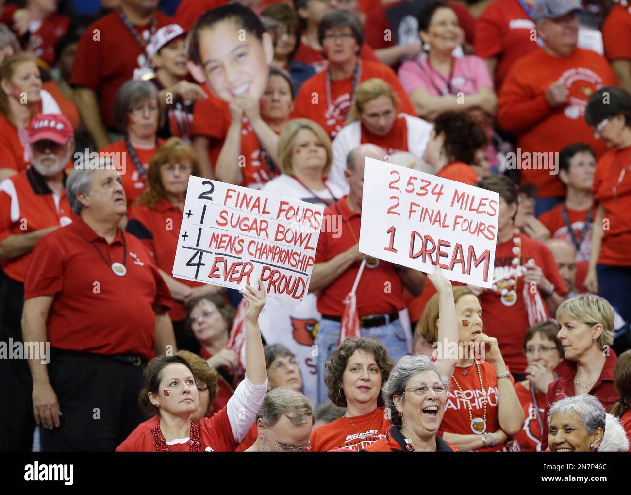 Louisville fans hold up signs before the national championship game