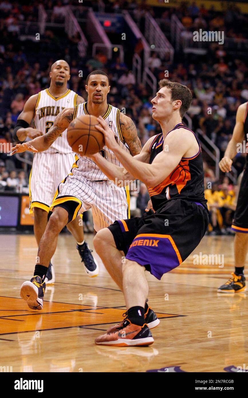 Phoenix Suns' Goran Dragic, right, of Slovenia, shoots in front of ...