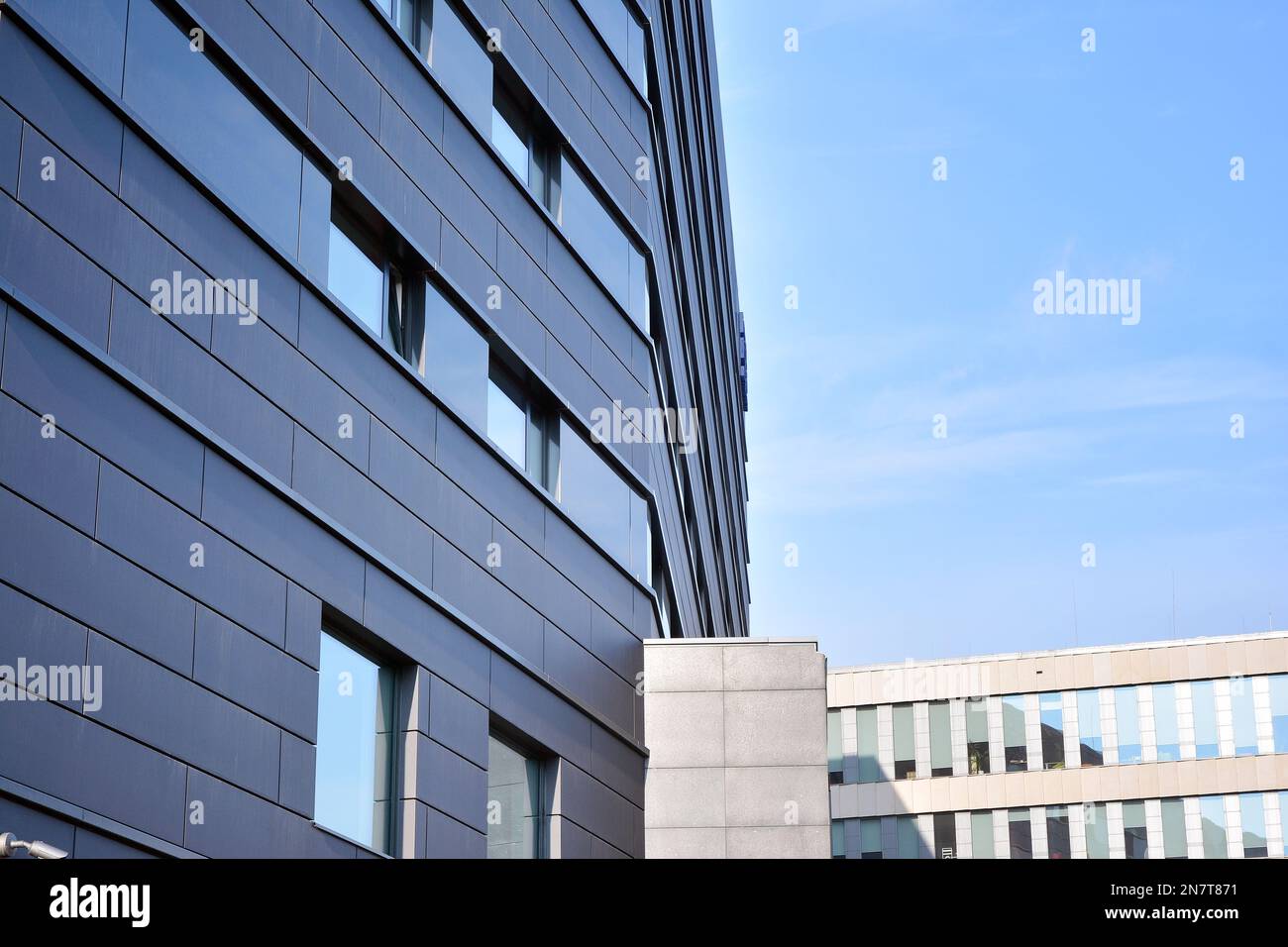 Wall of a modern commercial building with aluminum metal composite ...