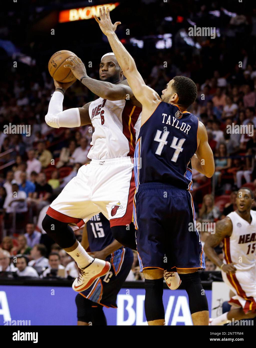 Charlotte Bobcats' Jeff Taylor (44) defends against Miami Heat's LeBron ...