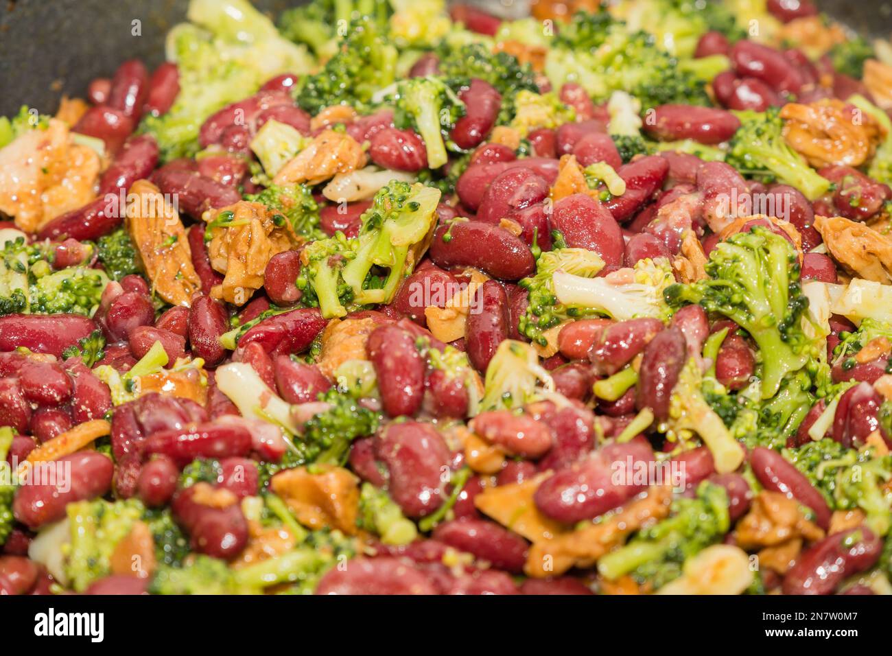 vegan dish with broccoli, red bean and Heura vegan meat Stock Photo Alamy