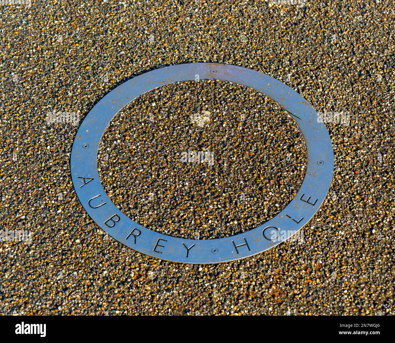 Steel ring marking location of an Aubrey Hole, Stonehenge, Wiltshire, England, UK Stock Photo