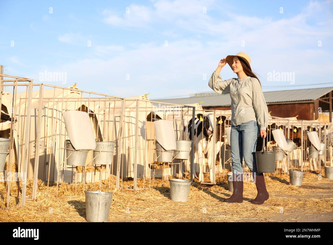 Woman smiling animal enclosure hi-res stock photography and images - Alamy