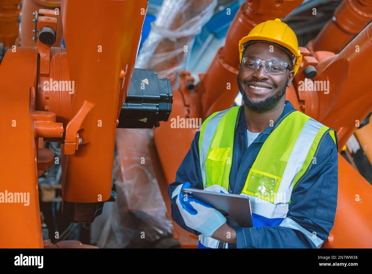 happy smiling engineer worker African black people work in factory industry Stock Photo