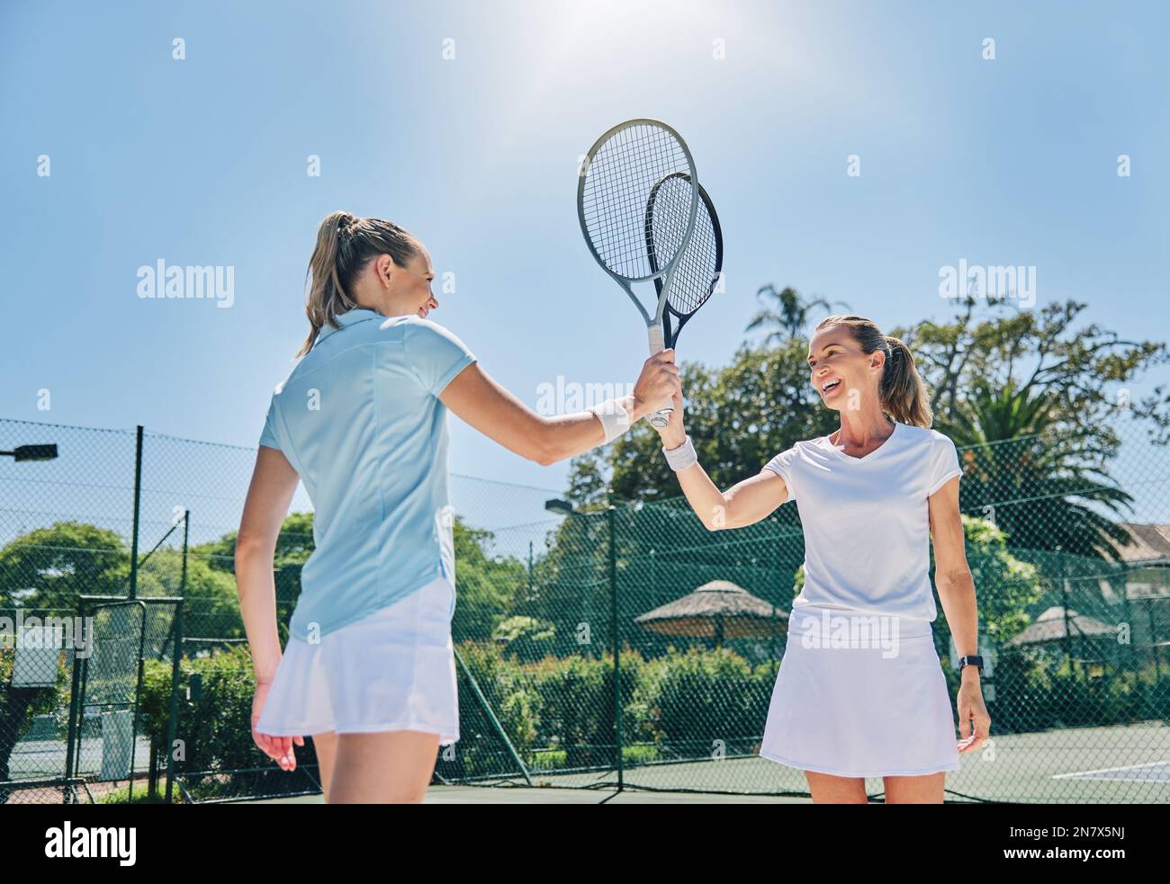 Tennis, racket high five and women teamwork for sport game outdoor for ...