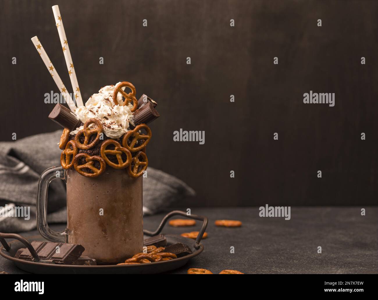front view chocolate milkshake with straws pretzels Stock Photo Alamy