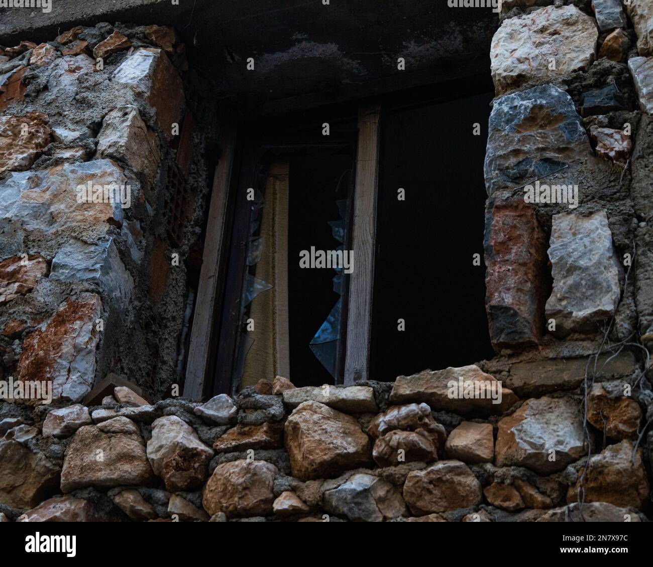 A broken window of stony building Stock Photo - Alamy