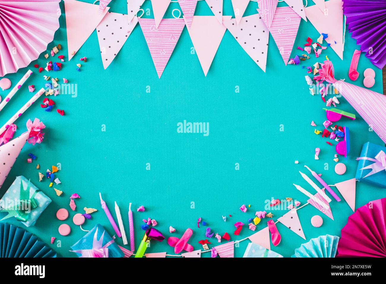 elevated view gift boxes various party accessories green background