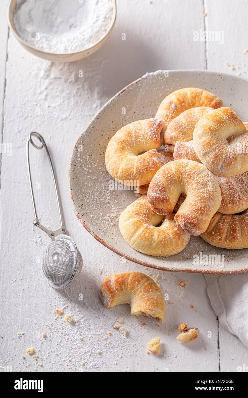 Crispy and golden croissants with powdered sugar. Treats for Fat