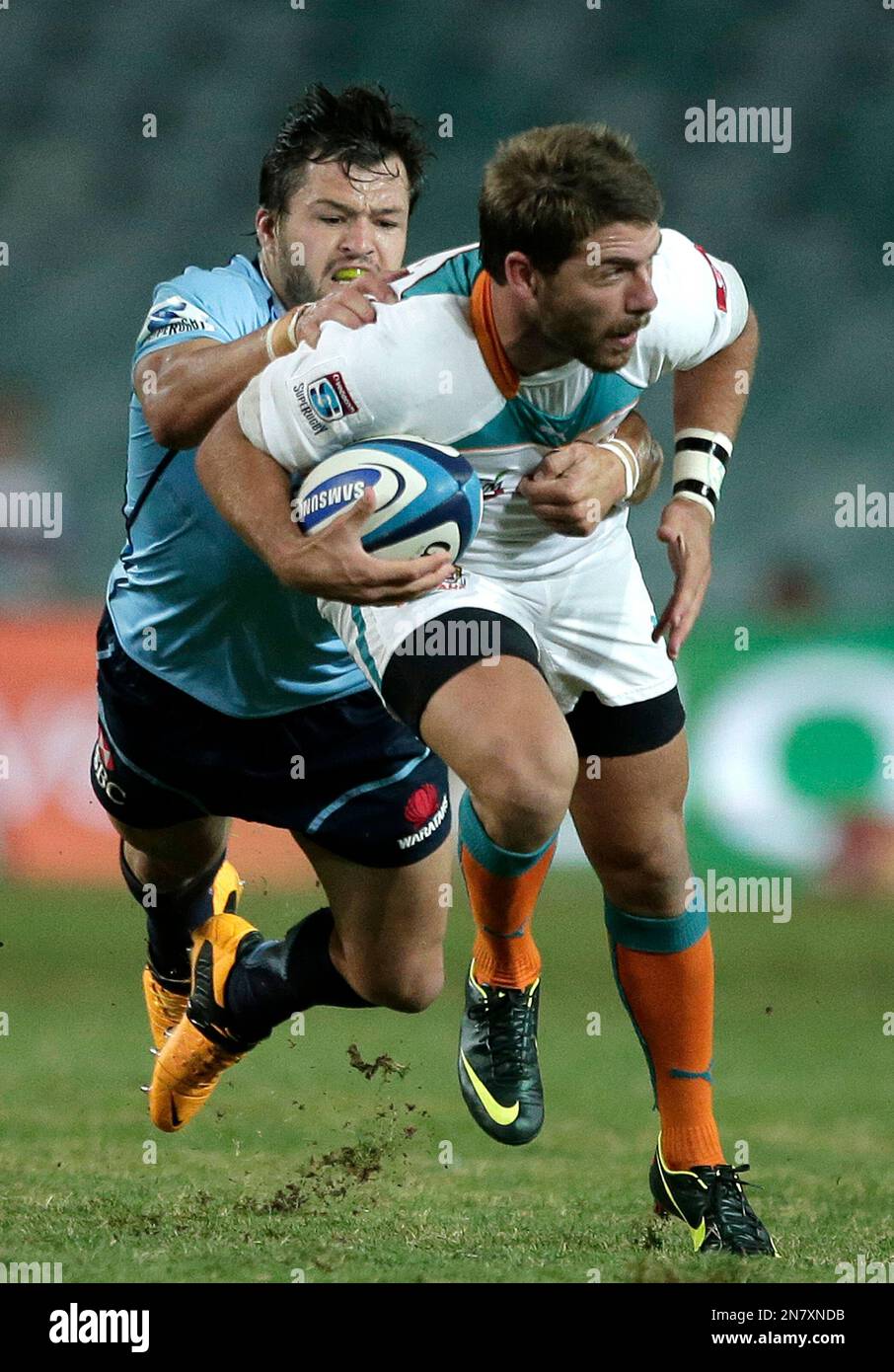 Waratahs' Adam Ashley-Cooper, left, tries to drag down Willie le Roux ...