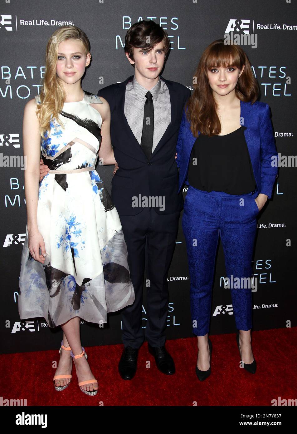 Cast members Freddie Highmore, center, Nicola Peltz, left, and Olivia Cooke pose together at the