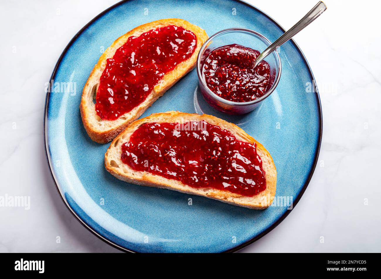 Raspberry jam on toast Stock Photo Alamy