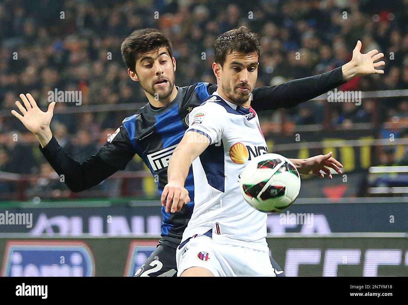 Inter Milan midfielder Marco Benassi, left, challenges for the ball