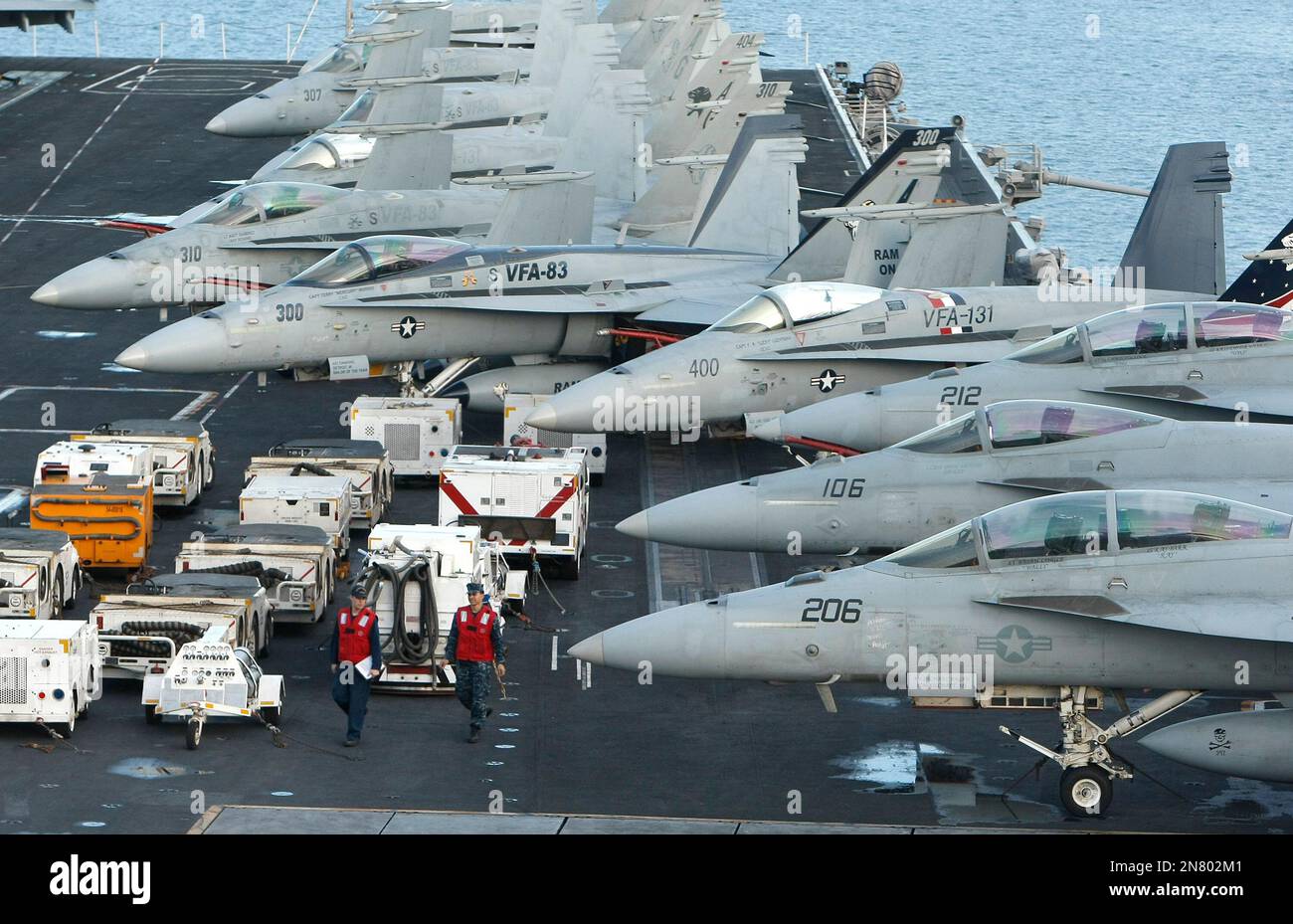 War planes are parked on the deck of the American nuclear-powered aircraft carrier USS Dwight D. Eisenhower, in Marseille harbor, southern France, Friday, March 8, 2013. US aircraft carrier USS Dwight D. Eisenhower departed from Norfolk, Virginia, USA on Feb 21 and stopped in Marseille, southern France, en route for the Mediterranean sea and Indian Ocean. (AP Photo/Claude Paris) Stock Photo