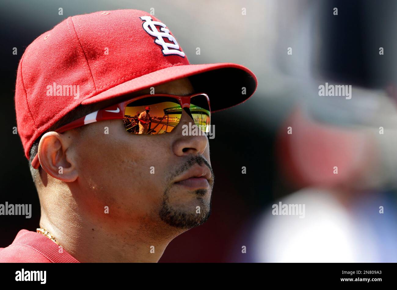 St. Louis Cardinals third base coach Jose Oquendo walks in the dugout  wearing the uniform of the St. Louis Stars of the Negro League before a  baseball game against the Pittsburgh Pirates