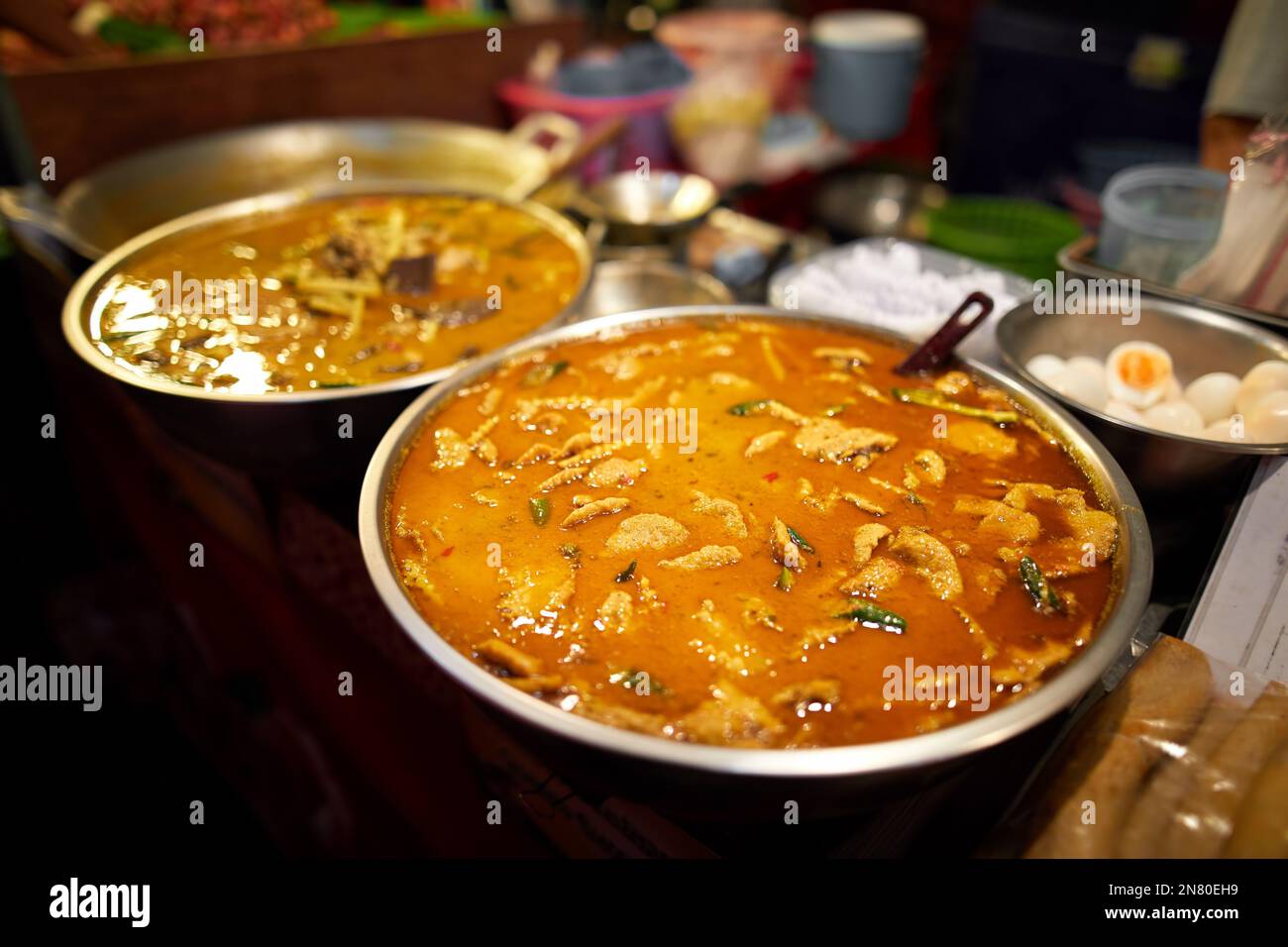 Street food of Thai big pot with chicken curry at night market at the Chinese New year in Bangkok Chinatown in Thailand Stock Photo