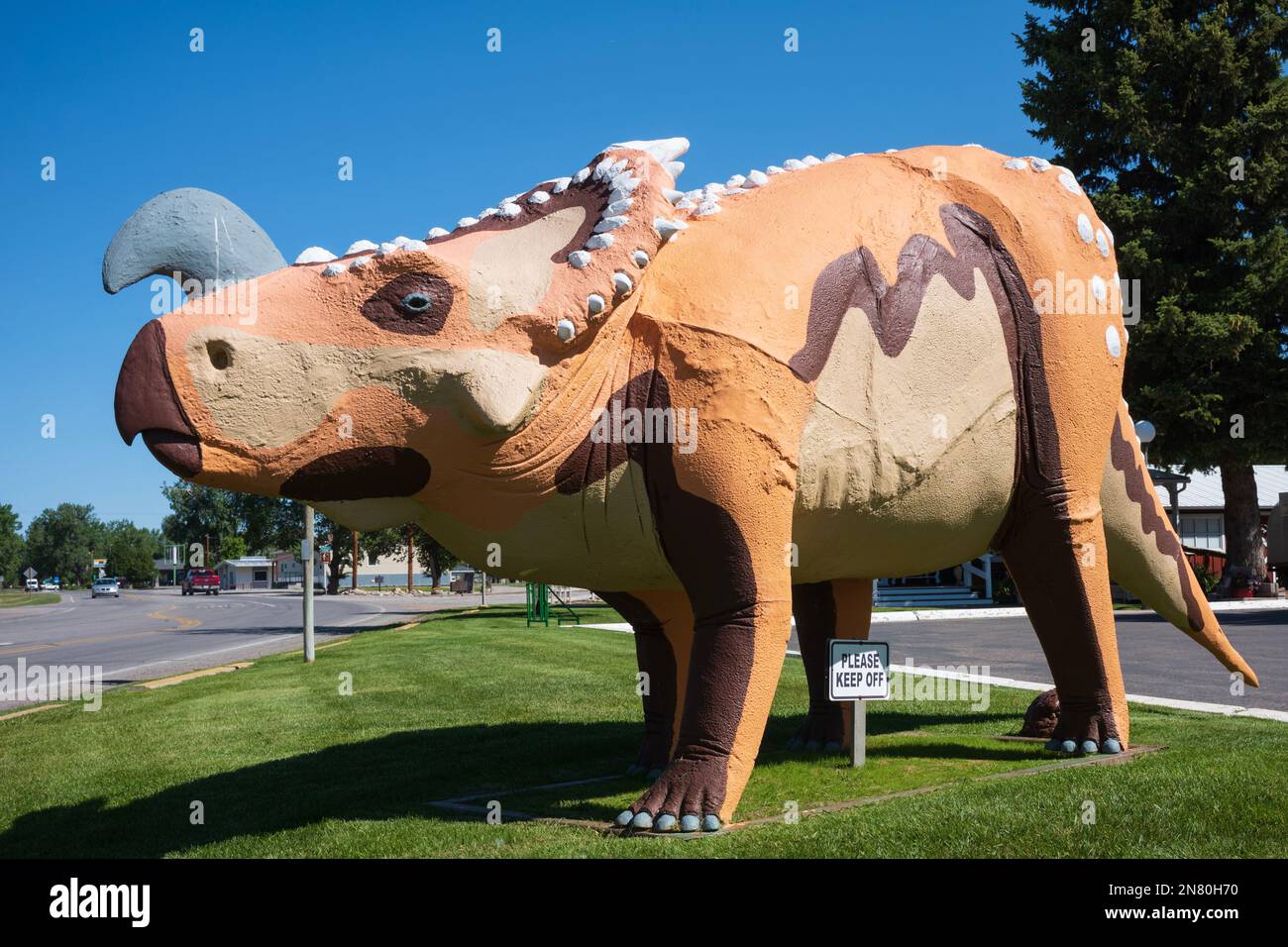Choteau, MT, USA - Jul 1, 2022:  Dinosour sculptures welcome visitors of the small town of Choteau that lies along U.S. Routes 89  that tourists trave Stock Photo