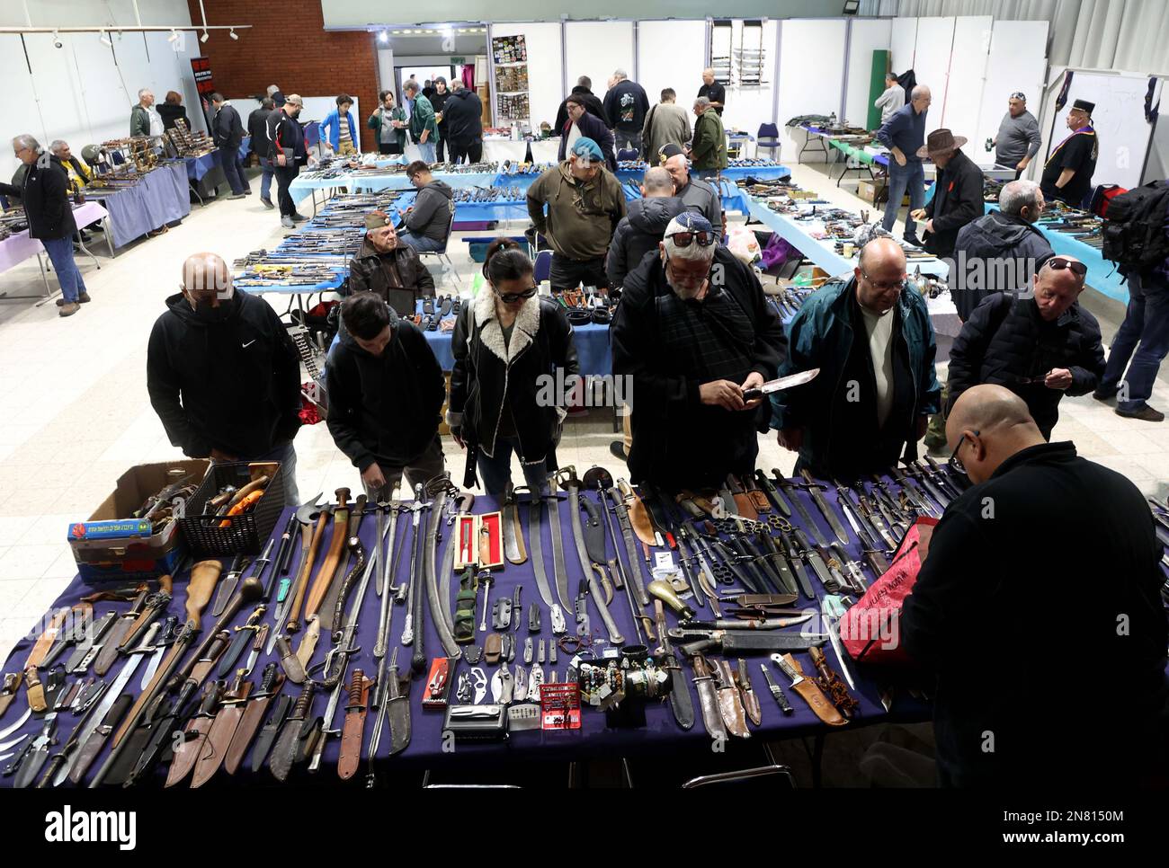 Ashkelon. 10th Feb, 2023. People visit an exhibition of historical cold weapons in the southern Israeli city of Ashkelon on Feb. 10, 2023. Swords, knives, bayonets, shields and other items from the 17th century to the middle of the 20th century were displayed at the exhibition. Credit: Gil Cohen Magen/Xinhua/Alamy Live News Stock Photo