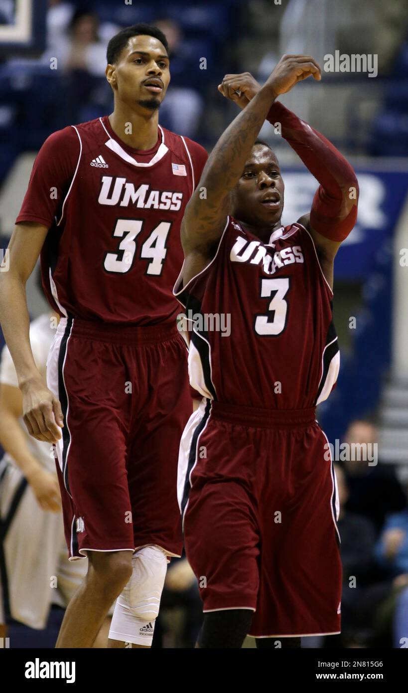 Massachusetts guard Chaz Williams (3) celebrates after they defeated ...