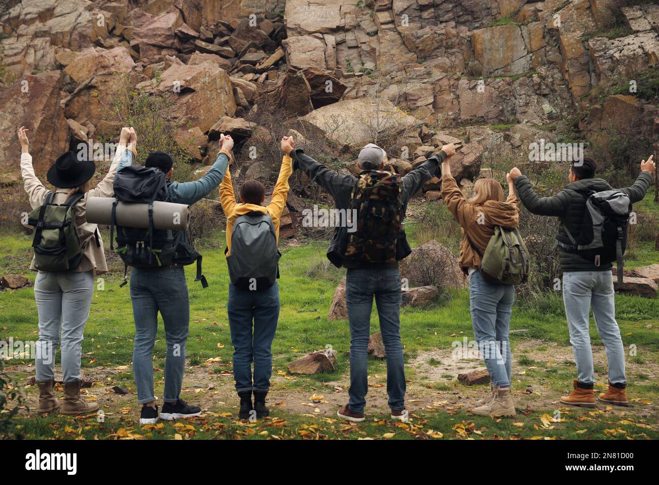 Group of hikers with backpacks in mountains, back view Stock Photo - Alamy