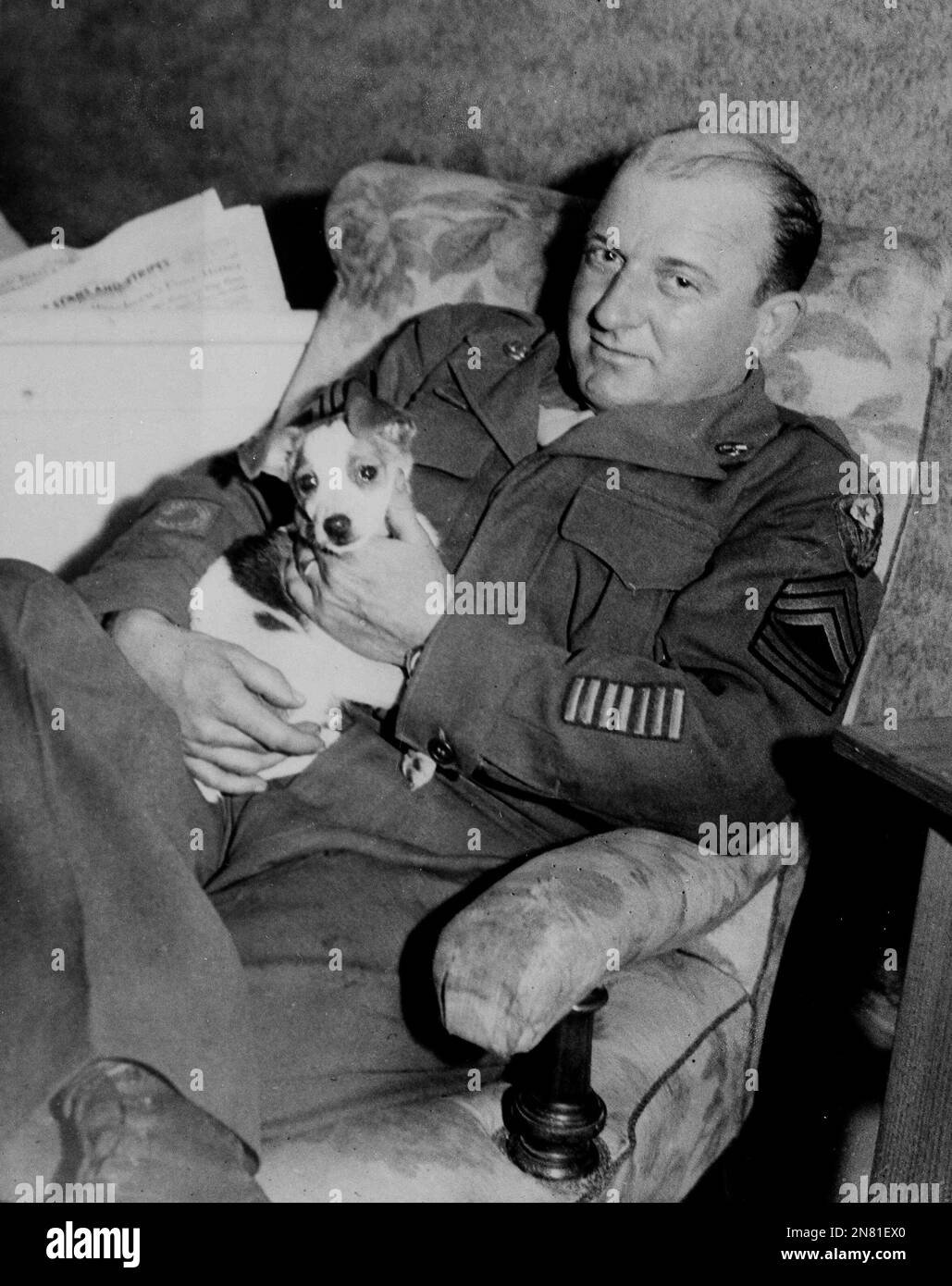 Master Sergeant James C. Woods, the soldier/hangman who executed the ten Nazis at Nuremberg, with his dog at Heidelberg, Germany, Oct. 18, 1946. (AP Photo) Stock Photo