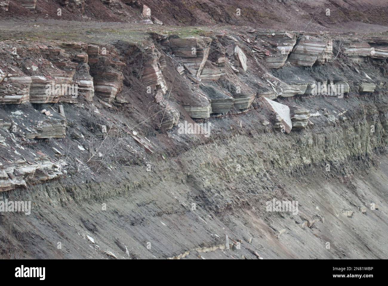 rugged, partially undermined Rock strata in Mining Stock Photo