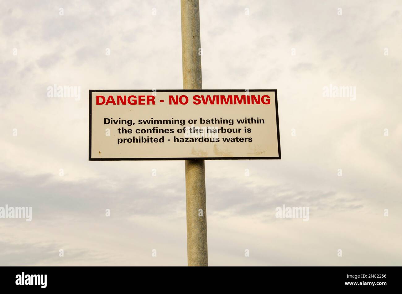 Danger, no swimming sign warning of hazardous waters in the harbour