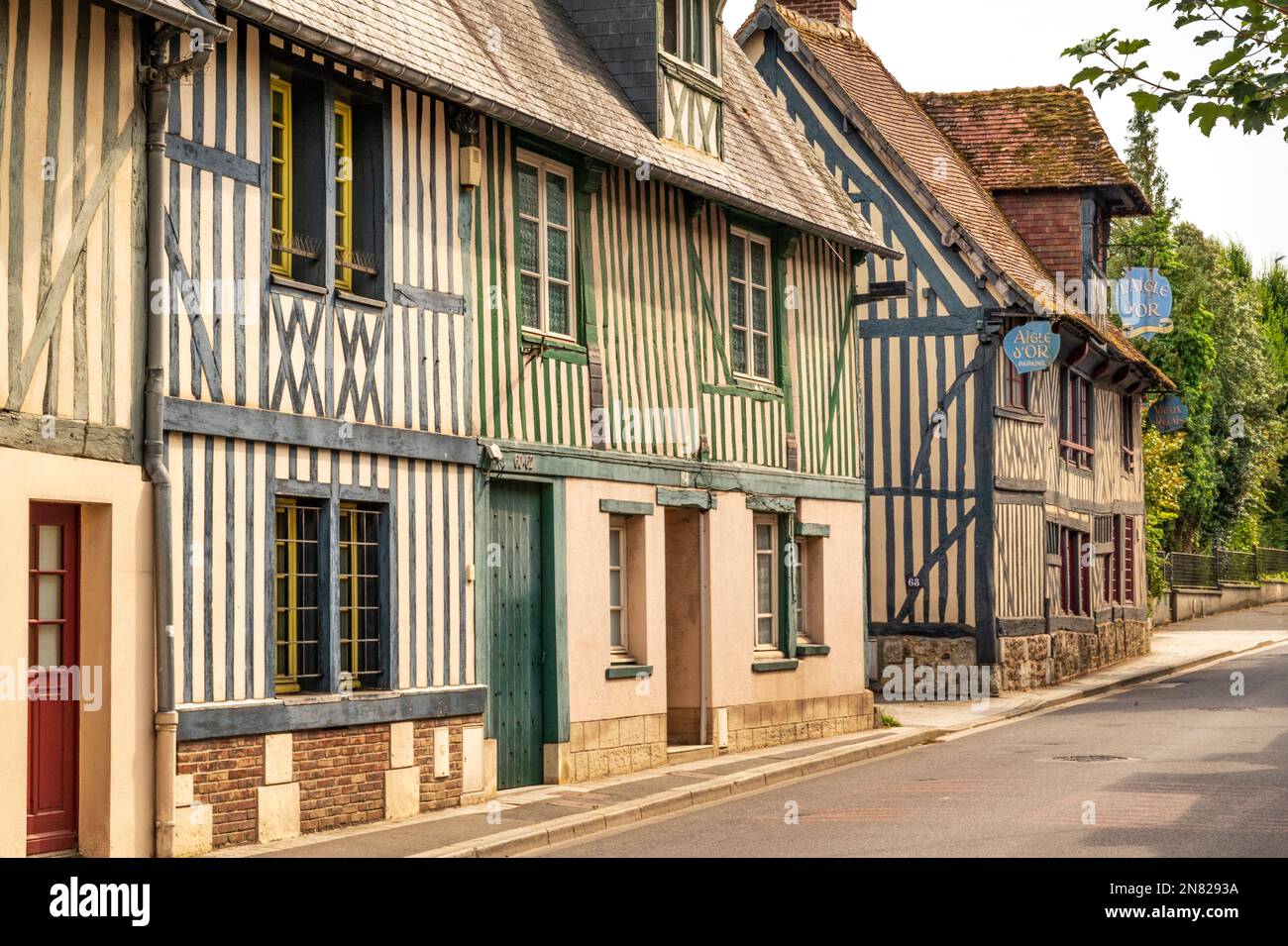 Tradtional medieval facades along the D 675 department road in Pont-l'Évêque, Normandy, France Stock Photo