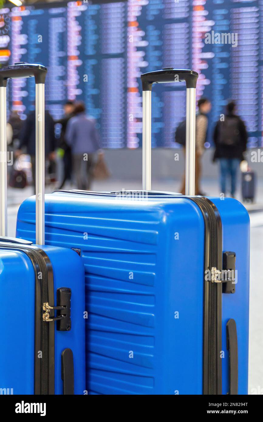 Travel Fashion. Closeup Shot Of Two Plastic Suitcases Standing At Airport, Stylish Luggage Bags Waiting At Terminal Hall, Banner For Air Travelling A Stock Photo